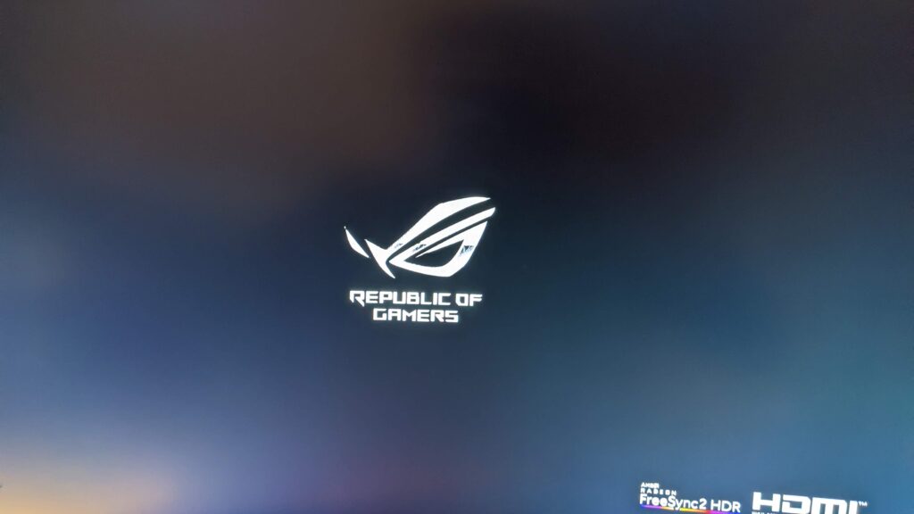 ASUS ROG Strix XG32VQR curved gaming monitor showing its start-up screen