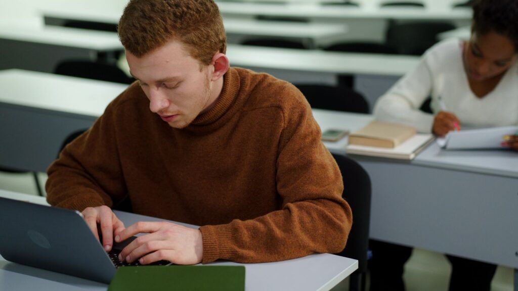 Hands typing keyboard shortcuts to copy and paste on a Chromebook