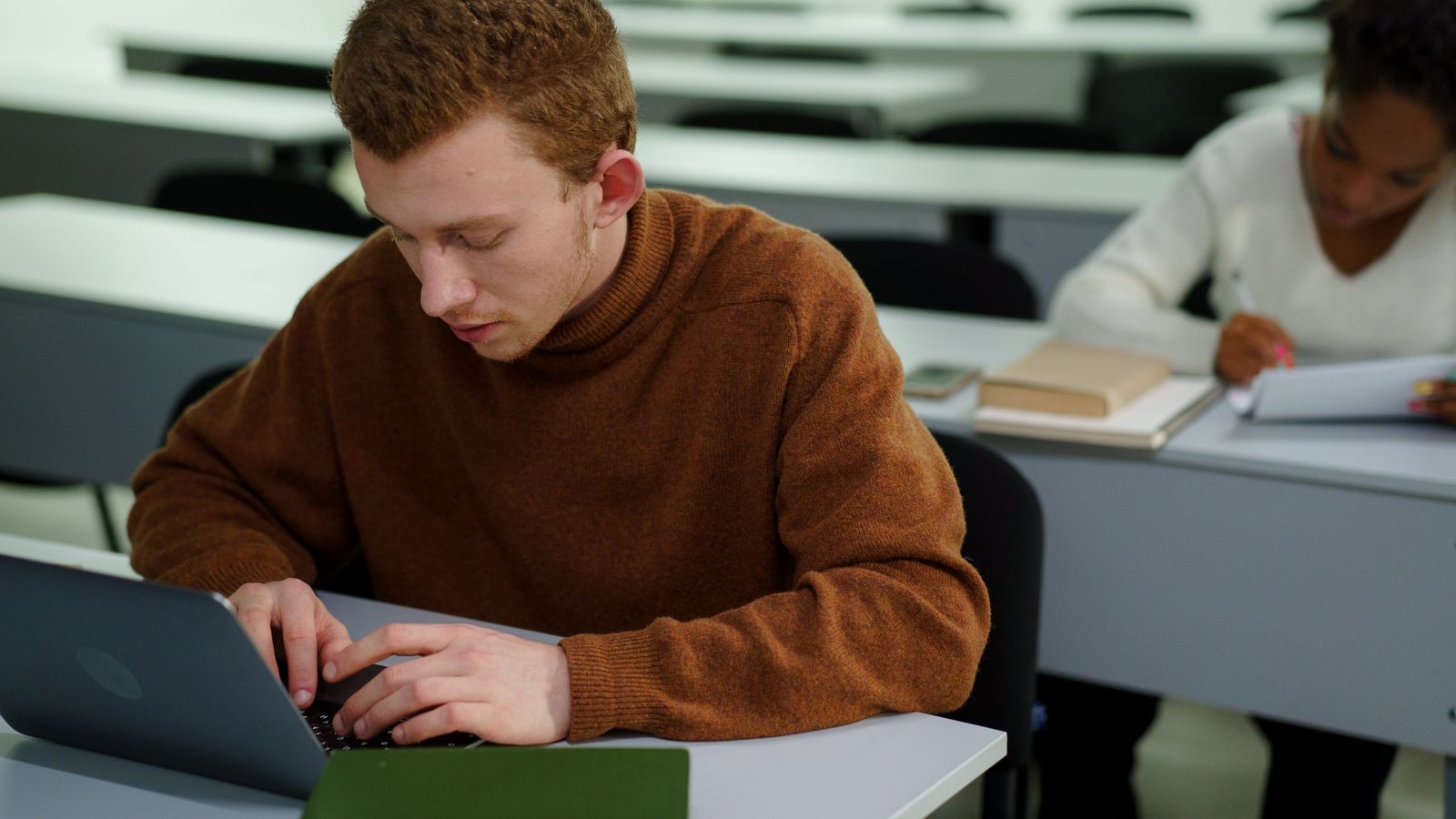 Hands typing keyboard shortcuts to copy and paste on a Chromebook