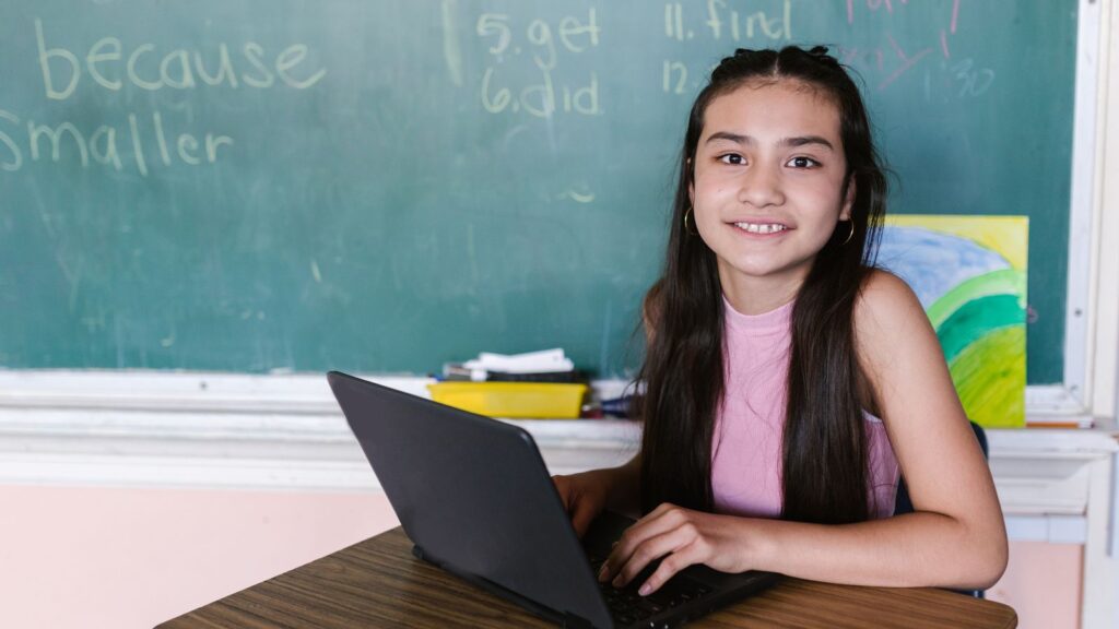 A student using a Chromebook in class, taking a screenshot