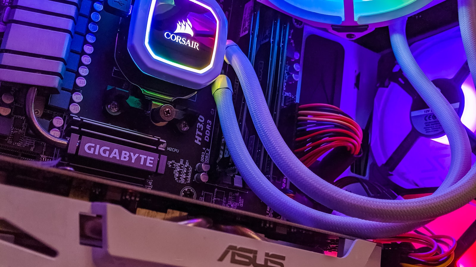 An all-in-one liquid CPU cooler with RGB lighting installed on a motherboard inside a gaming PC (CPU cooling 2026)