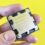 AMD Ryzen 7 processor held against a yellow background