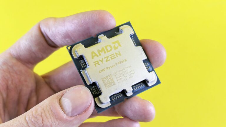 AMD Ryzen 7 processor held against a yellow background