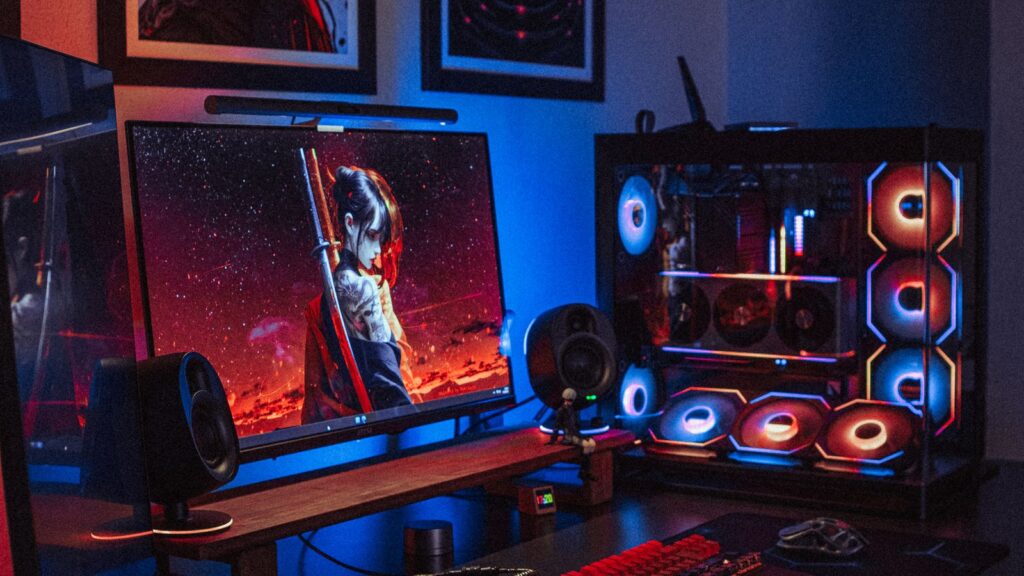 Gaming PC setup with an RGB tower and a gaming monitor on a desk