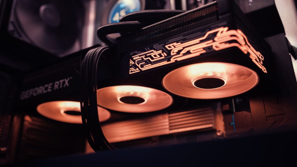 A high-end graphics card with lit fans installed in a PC case
