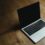 A MacBook on a desk, taking a screenshot on macOS