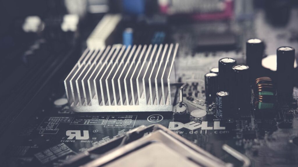 Motherboard VRM area with heatsink, capacitors and chokes near the CPU socket