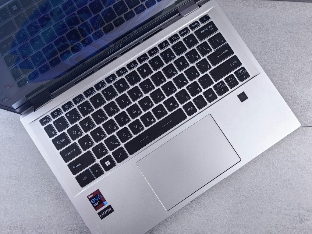 Close-up of an MSI laptop keyboard and trackpad with an Intel Evo i7 badge