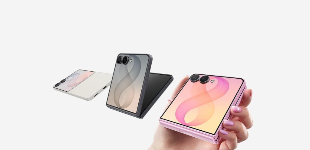 Three Samsung Galaxy Z Flip8 handsets in cream, graphite and pink, one held in a hand