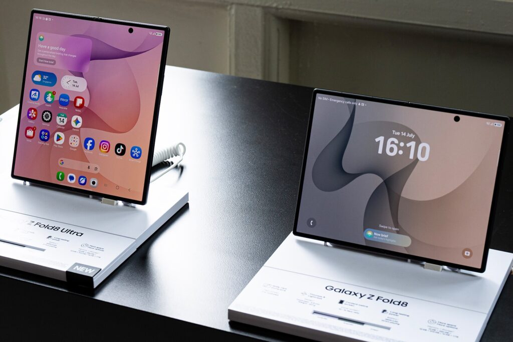 Samsung Galaxy Z Fold8 and Galaxy Z Fold8 Ultra unfolded side by side on a retail display