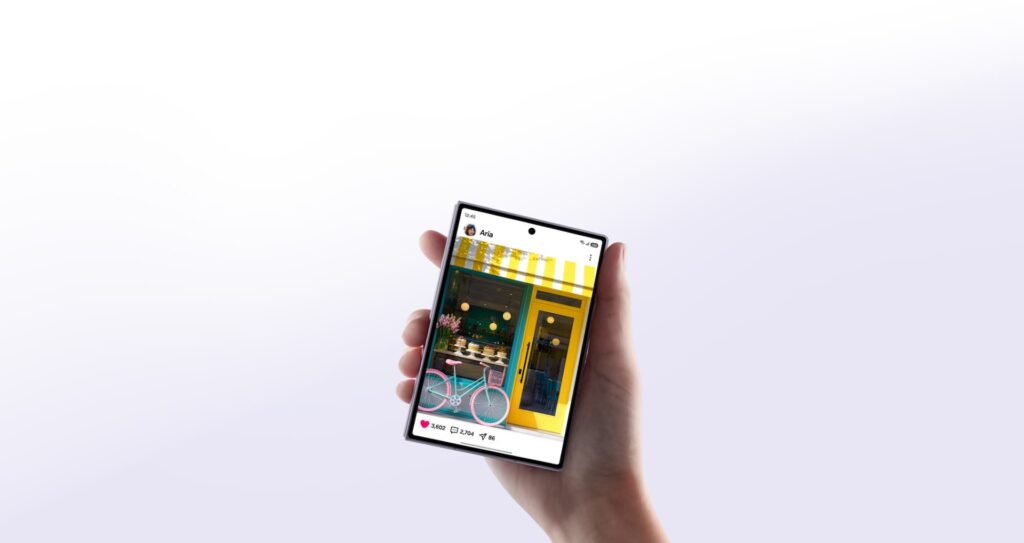 The wider Galaxy Z Fold8 held open in one hand showing its 4:3 main screen