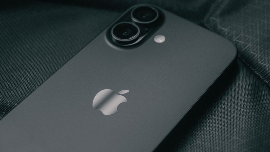 The back of a black standard iPhone showing its dual camera and Apple logo