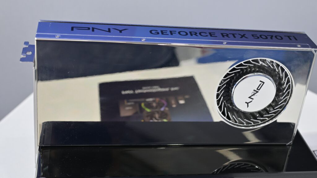 PNY GeForce RTX 5070 Ti graphics card with a chrome shroud on display at Computex 2025