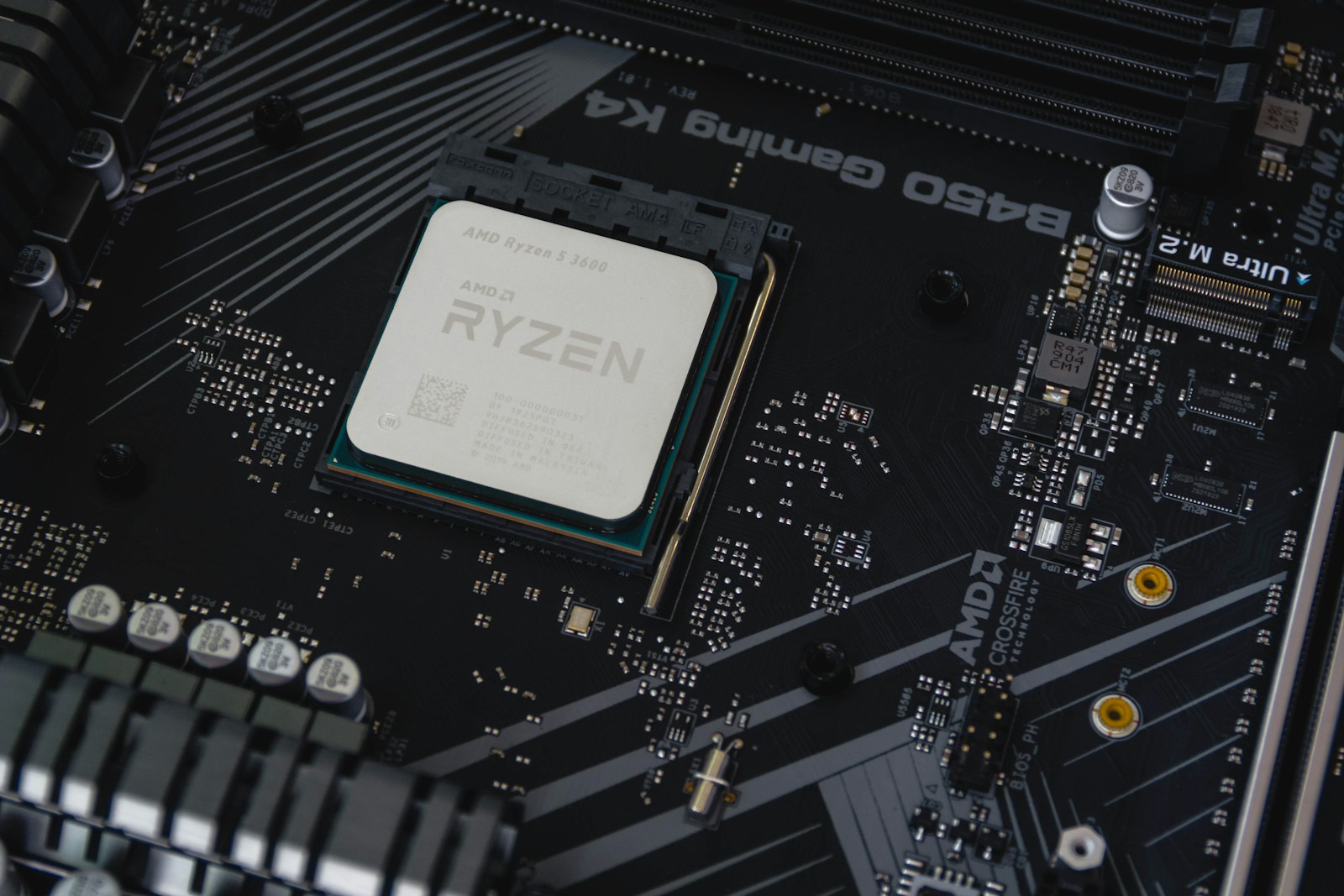 AMD Ryzen 5 3600 processor with its model name printed on the heatspreader, fitted to a B450 motherboard
