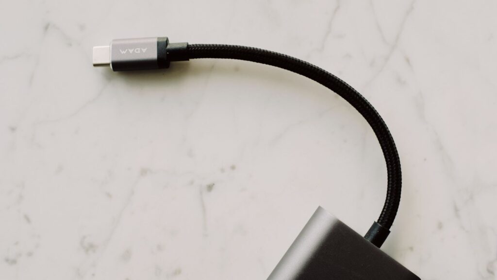 Close-up of a braided USB-C connector plugging into an adapter