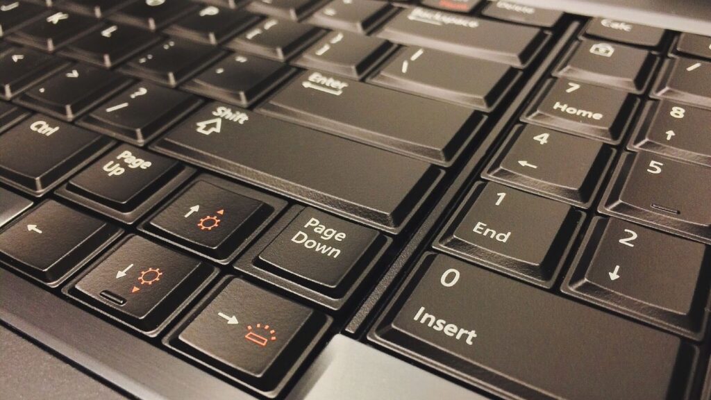 Print Screen or Snipping Tool? How to Screenshot on Windows on Any Keyboard | Hardvance Laptop keyboard showing the orange Fn function layer symbols