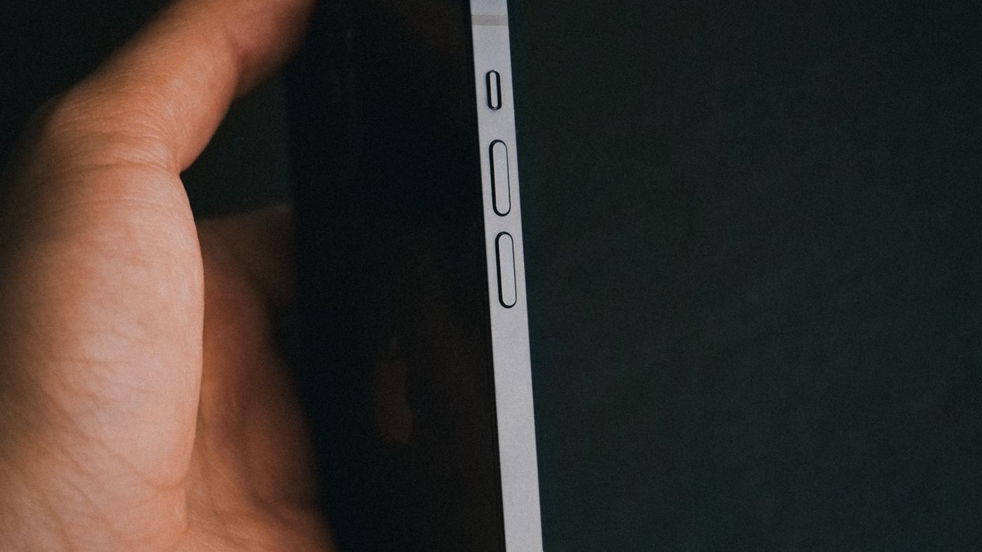 Close-up of the side edge of a phone showing the side button and volume keys