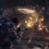 Marcus Fenix and his squad fire at Locust enemies under a burning bridge in Gears of War: E-Day