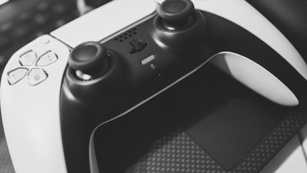 Close-up of a PlayStation 5 DualSense controller showing both analogue thumbsticks