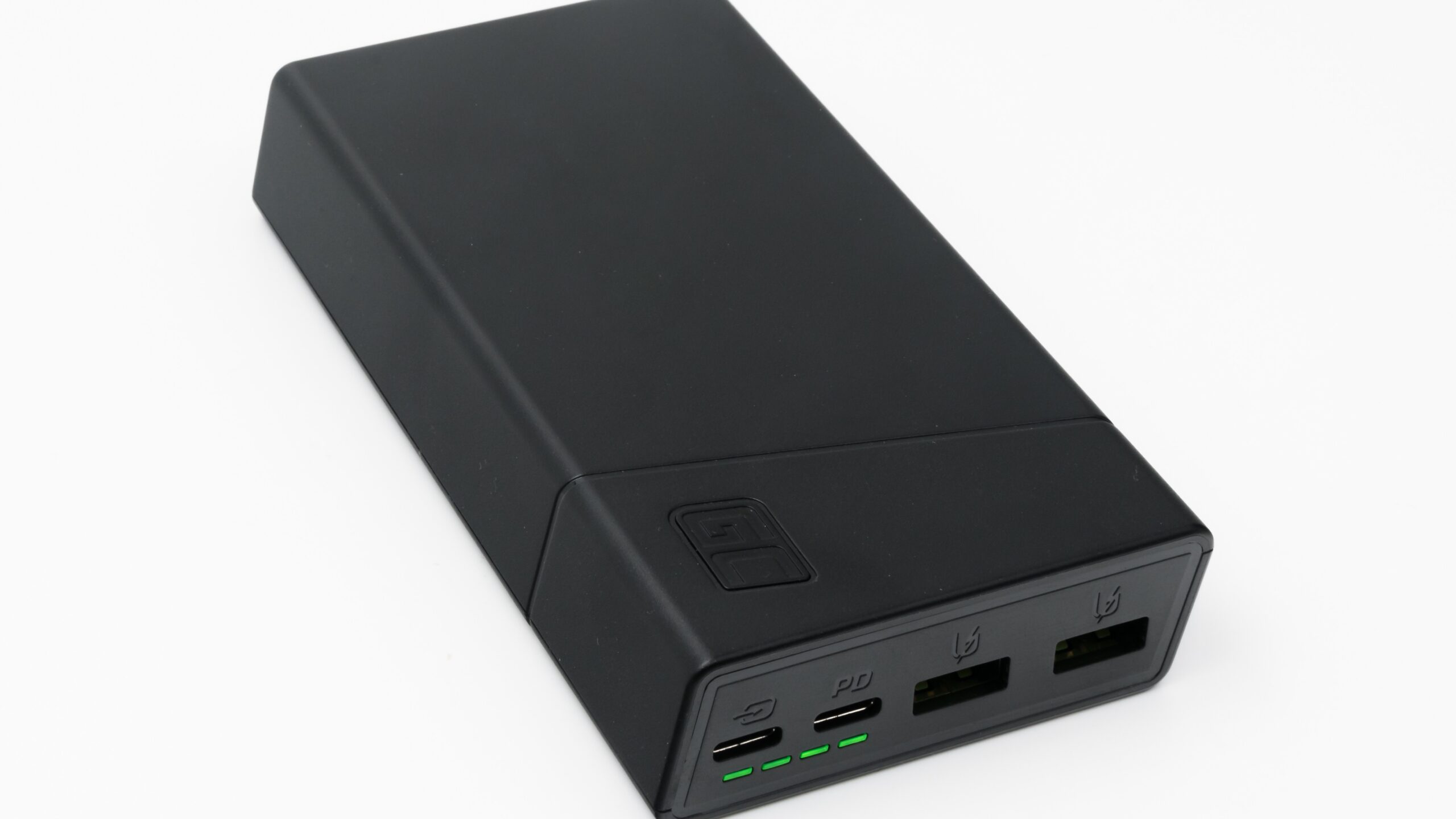 Black 20,000mAh power bank showing two USB-C ports and two USB-A ports with green charge lights