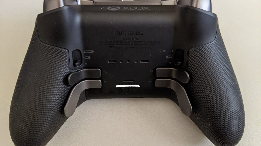 Underside of an Xbox Elite Wireless Controller Series 2 showing its four metal paddles